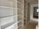 Large white shelving units offer ample storage space and a modern design element at 1216 Barcroft Pl, Raleigh, NC 27615
