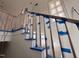 A newly installed staircase with a stained handrail, ready for the final touches at 1216 Barcroft Pl, Raleigh, NC 27615