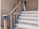 A newly installed staircase with a stained handrail, ready for the final touches at 1216 Barcroft Pl, Raleigh, NC 27615