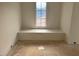 A cozy window seat with a view creates a peaceful retreat within the room at 1216 Barcroft Pl, Raleigh, NC 27615