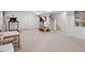 Finished basement with carpet flooring, stairs, and an open layout for recreation at 1417 Hathaway Rd, Raleigh, NC 27608