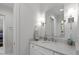 Bright bathroom with a quartz countertop vanity and modern fixtures at 1417 Hathaway Rd, Raleigh, NC 27608