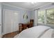 Well-lit bedroom with natural light, hardwood floors, and ample closet space at 1417 Hathaway Rd, Raleigh, NC 27608