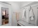 Hallway with a built-in bench and access to a bedroom with en-suite bathroom at 1417 Hathaway Rd, Raleigh, NC 27608