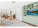 Open concept living room boasts built-in shelving, recessed lighting, and flows to the dining area at 1417 Hathaway Rd, Raleigh, NC 27608