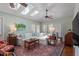 Bright sunroom with skylights, neutral walls, wood floors, and comfortable furnishings, offering a relaxing space at 1417 Hathaway Rd, Raleigh, NC 27608
