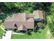 Overhead aerial view of a brick home with an extension, surrounded by lush greenery at 1481 Country Club Rd, Roxboro, NC 27574