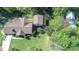 Aerial view of a home with a large lot and mature trees offering privacy at 1481 Country Club Rd, Roxboro, NC 27574