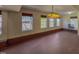 Spacious basement area with three windows, laminate flooring and interesting hanging lighting at 1481 Country Club Rd, Roxboro, NC 27574