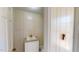 Cozy half bathroom showcasing a white vanity and framed mirror at 1481 Country Club Rd, Roxboro, NC 27574
