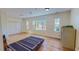 Spacious bedroom with hardwood floors, natural light, and double door closet at 1481 Country Club Rd, Roxboro, NC 27574