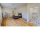 Large room with hardwood floors, bed, and filing cabinet at 1481 Country Club Rd, Roxboro, NC 27574