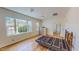 Bedroom with hardwood floors, large windows, and lots of natural light at 1481 Country Club Rd, Roxboro, NC 27574