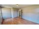 Bedroom with hardwood floors, closet, and windows at 1481 Country Club Rd, Roxboro, NC 27574