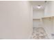 Empty walk-in closet with tile floor and wooden hanging racks at 1481 Country Club Rd, Roxboro, NC 27574