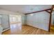 Open dining area features hardwood floors and a modern chandelier at 1481 Country Club Rd, Roxboro, NC 27574