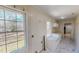 Bright, large kitchen featuring white cabinets and marble style flooring at 1481 Country Club Rd, Roxboro, NC 27574