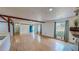 Hardwood floors, natural light, and a stone fireplace creates an inviting living space at 1481 Country Club Rd, Roxboro, NC 27574