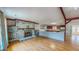 A spacious living room features a stone fireplace and hardwood floors at 1481 Country Club Rd, Roxboro, NC 27574