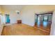 Bright living room featuring hardwood floors, a chandelier, and natural light at 1481 Country Club Rd, Roxboro, NC 27574