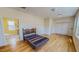 Large main bedroom with hardwood flooring, ample closet space, and a full bathroom at 1481 Country Club Rd, Roxboro, NC 27574