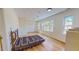 Spacious main bedroom with hardwood floors, natural light, and ample closet space at 1481 Country Club Rd, Roxboro, NC 27574