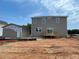 New two-story home with a backyard deck and a separate unfinished detached one-car garage, enhancing outdoor living at 15 Atherton Circle, Angier, NC 27501