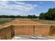 View from the wooden deck showcasing the surrounding neighborhood and green spaces at 15 Atherton Circle, Angier, NC 27501