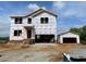 Exterior view of the new home with 2-car garage, showing the front entrance and architectural details at 15 Atherton Circle, Angier, NC 27501