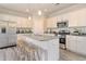 Well-equipped kitchen features stainless steel appliances, granite countertops, and a central island with bar seating at 15 Atherton Circle, Angier, NC 27501