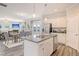 Open-concept kitchen featuring stainless steel appliances, granite countertops, and seamless flow into the dining and living areas at 15 Atherton Circle, Angier, NC 27501