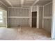 An unfinished room featuring drywall awaiting design and finishing with space for personalized touches at 15 Atherton Circle, Angier, NC 27501