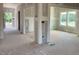 An unfinished living room showcasing drywall ready for customization and an open layout with natural light at 15 Atherton Circle, Angier, NC 27501