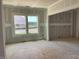 Unfinished room ready for personalization, featuring drywall and natural light through a double hung window at 15 Atherton Circle, Angier, NC 27501