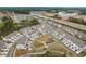Aerial view of new construction neighborhood with townhomes and major highway at 1613 Clayfire Dr, Cary, NC 27519