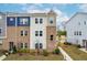 Attractive townhome featuring brick accents, varied siding and a well-maintained front yard at 1613 Clayfire Dr, Cary, NC 27519