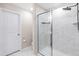 The bathroom features a glass shower with bright white tile, marble floors, and modern fixtures at 1613 Clayfire Dr, Cary, NC 27519