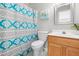 Bright bathroom featuring a floral shower curtain, single sink, and vanity at 200 Adefield Ln, Holly Springs, NC 27540