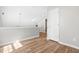 Upstairs hallway with wood floors leading to various rooms at 200 Adefield Ln, Holly Springs, NC 27540