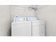 Laundry room with a washer and dryer and overhead storage at 200 Adefield Ln, Holly Springs, NC 27540