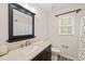 Bathroom featuring a vanity, mirror, and shower at 2032 Stoneglen Ln, Raleigh, NC 27603