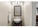 Contemporary powder room featuring a modern vessel sink and designer fixtures at 2032 Stoneglen Ln, Raleigh, NC 27603