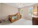 Bedroom with a bed, windows, ceiling fan, and dresser at 2032 Stoneglen Ln, Raleigh, NC 27603