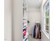 Walk-in closet with a window, built-in shelving, and hanging racks at 2032 Stoneglen Ln, Raleigh, NC 27603