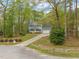 Well-maintained home with a spacious front yard, colorful landscaping, and a lovely yellow door at 2032 Stoneglen Ln, Raleigh, NC 27603