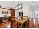 Bright eat-in kitchen features wood cabinets, stainless steel appliances, and a dining table at 2032 Stoneglen Ln, Raleigh, NC 27603