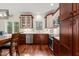 Stylish eat-in kitchen with stainless appliances, wood cabinets, and a large window at 2032 Stoneglen Ln, Raleigh, NC 27603