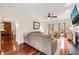 Open living room with hardwood floors, fireplace, windows, and access to dining room with wood cabinets at 2032 Stoneglen Ln, Raleigh, NC 27603