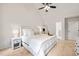 Spacious main bedroom features neutral walls, ceiling fan, and cozy carpet at 2032 Stoneglen Ln, Raleigh, NC 27603