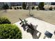 Overhead view of a backyard patio with chairs, table, and manicured landscaping creating an inviting outdoor space at 208 Evanview Ct, Apex, NC 27523